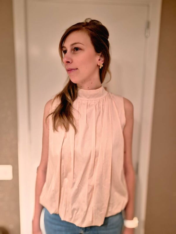 Roze blouse met strik en open rug